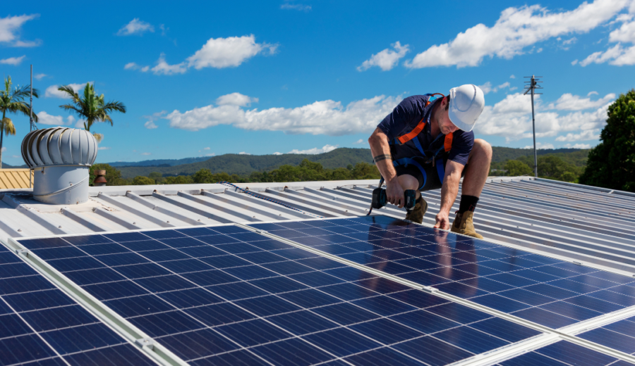 Man installing a solar panel